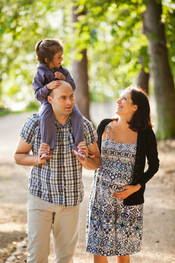 A young family walking in the park